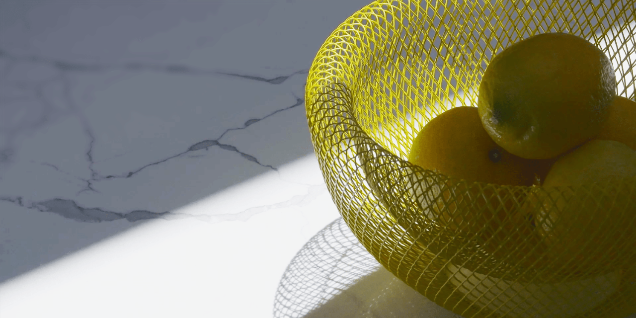 Designing with light - lemons in yellow basket in sunlight